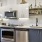 Midtown Sacramento, CA Pet-Friendly Luxury Apartments - Press at Midtown- Kitchen with Open Shelves, Quartz Countertops, and Stainless-Steel Appliances